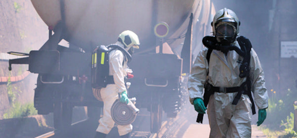 Workers in hazmat suits